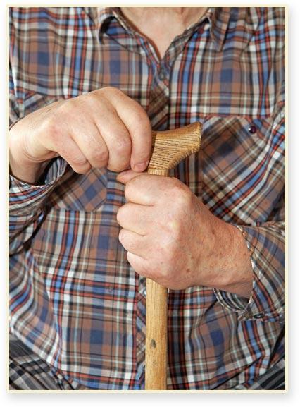 Elder man holding a cane